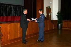 Col. Rob Boots, RNLAF (r), program manager, Information and Technology Division (BG IVENT), receives a token of appreciation for his October presentation from Rear Adm. Voogt.